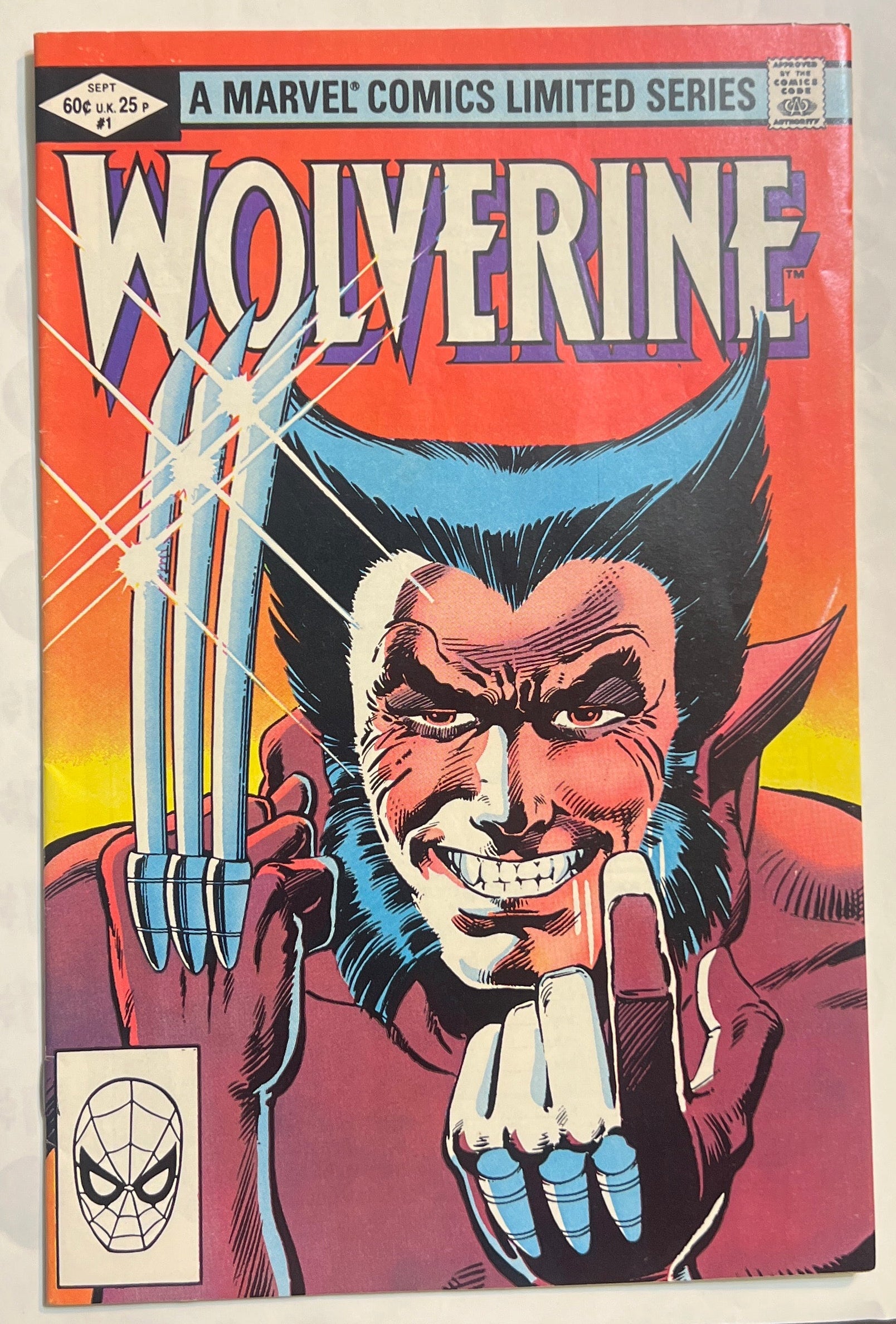 Vintage Marvel Comics Limited Series Wolverine comic book, issue #1, featuring a bold red and orange cover with Wolverine's face and claws extended.
